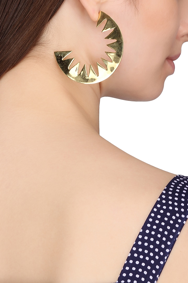 Gold plated cresent shaped earrings available only at Pernia's Pop Up Shop.