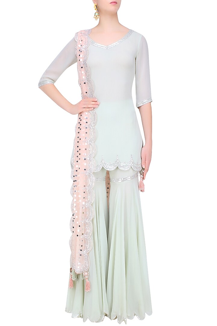 Pale blue sequins embroidered kurta and sharara pants set available only at Pernia's Pop Up Shop.
