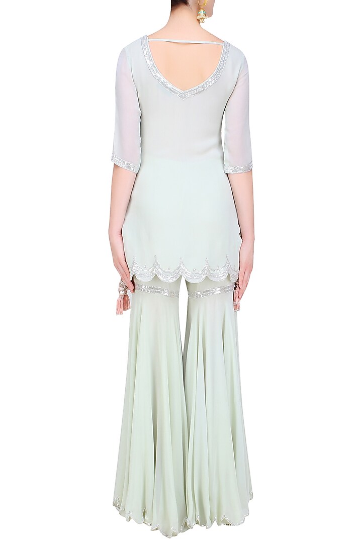 Pale blue sequins embroidered kurta and sharara pants set available only at Pernia's Pop Up Shop.