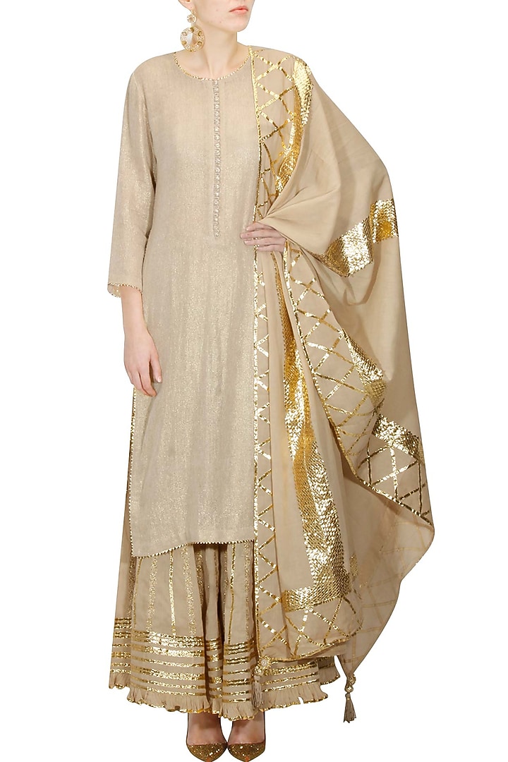 Beige and gold gota patti work kurta and sharara set available only at Pernia's Pop Up Shop.