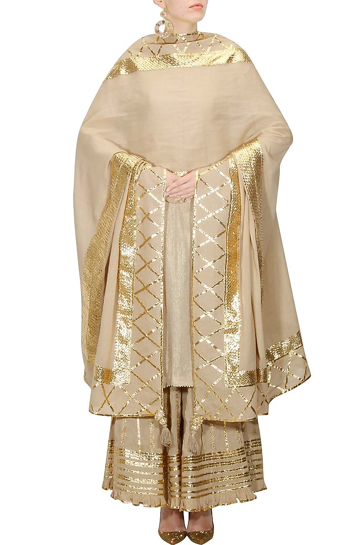 Beige and gold gota patti work kurta and sharara set available only at Pernia's Pop Up Shop.