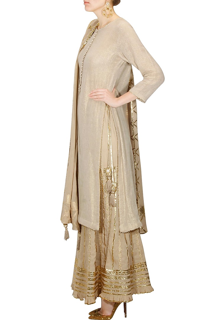 Beige and gold gota patti work kurta and sharara set available only at Pernia's Pop Up Shop.