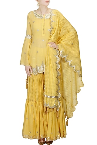Mustard yellow and gold gota patti work kurta and sharara set by Sukriti & Aakriti