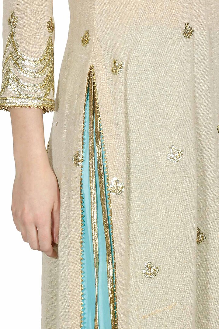 Beige gota patti work kurta and turquoise blue crushed skirt set available only at Pernia's Pop Up Shop.