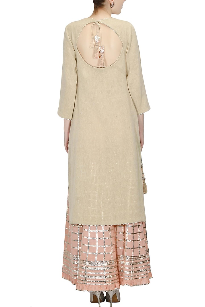 Beige gota patti work kurta and peach sharara pants set available only at Pernia's Pop Up Shop.