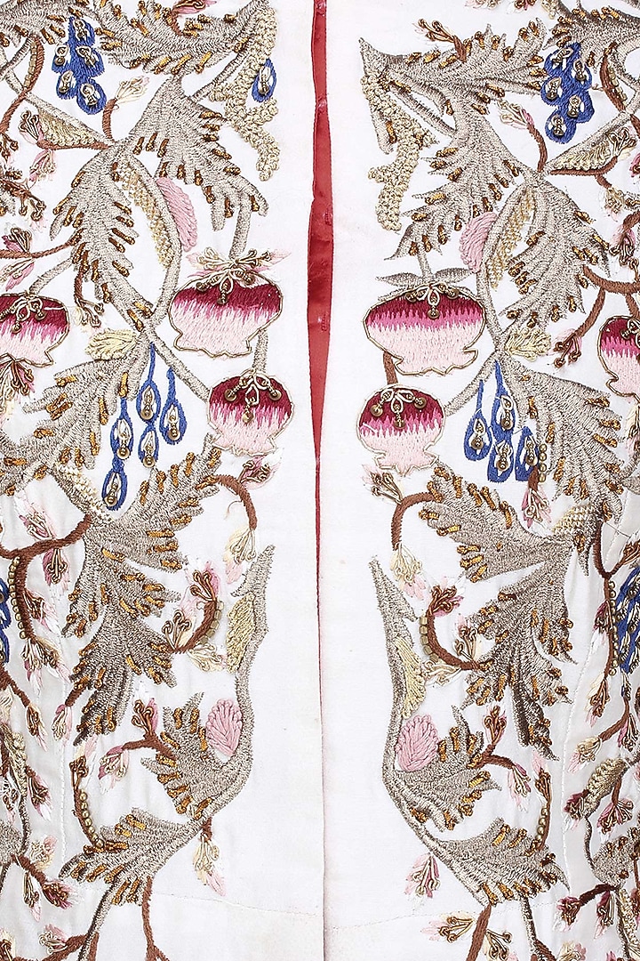 Off white silk thread and zari embroidered jacket with red skirt available only at Pernia's Pop Up Shop.