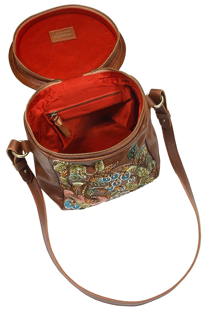 Brown silk thread and zari embroidered round leather bag available only at Pernia's Pop Up Shop.