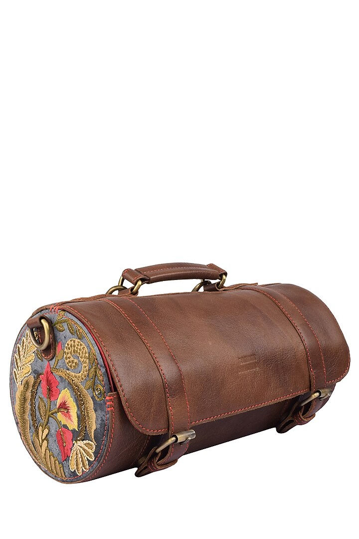 Samant Chauhan Accessories presents Brown silk thread and zari embroidered cylindrical leather bag available only at Pernia's Pop Up Shop.