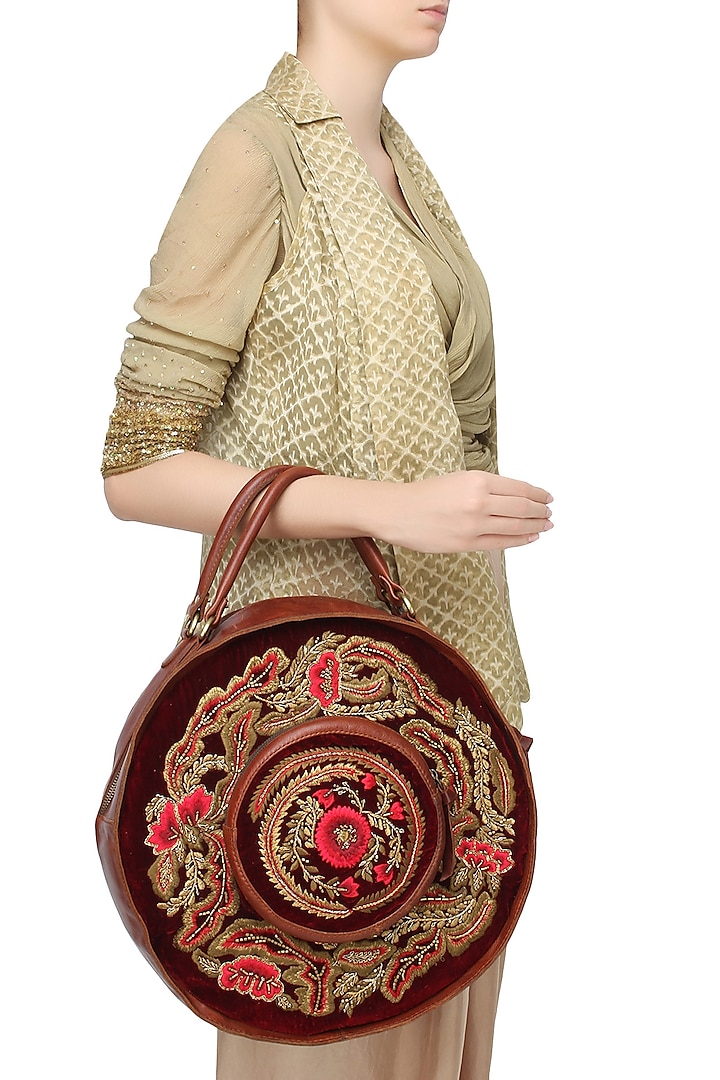 Samant Chauhan Accessories presents Brown and maroon floral embroidered round leather bag available only at Pernia's Pop Up Shop.