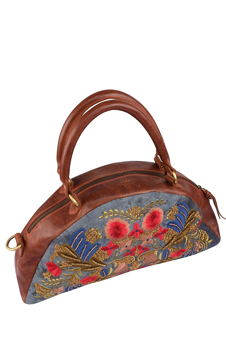 Samant Chauhan Accessories presents Blue and brown floral embroidered half moon leather duffle bag available only at Pernia's Pop Up Shop.