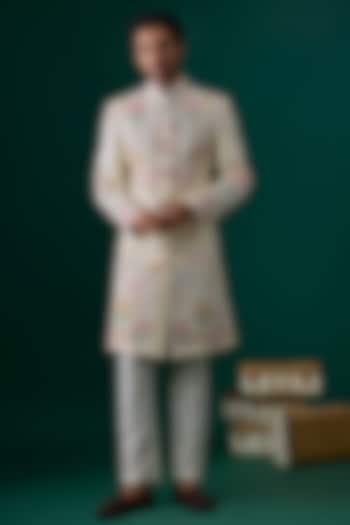 Ivory Raw Silk Hand & Machine Embroidered Groom Sherwani Set by SAMMOHAN at Pernia's Pop Up Shop