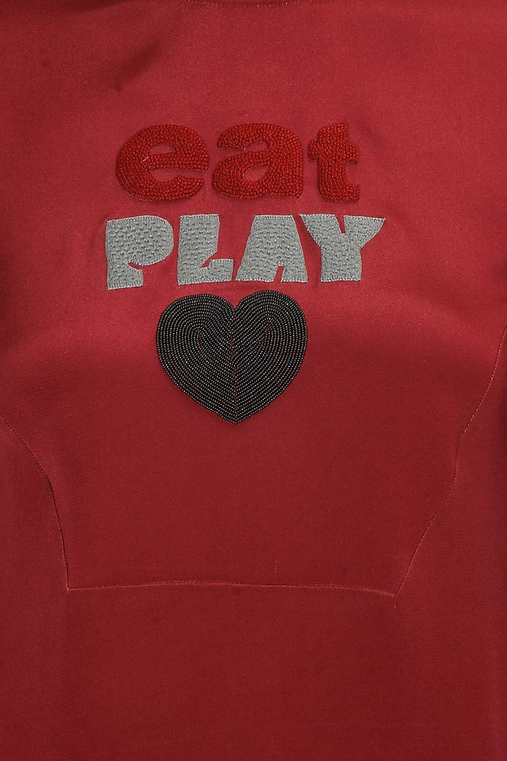 Maroon embroidered motif "Eat Play Love" top available only at Pernia's Pop Up Shop.