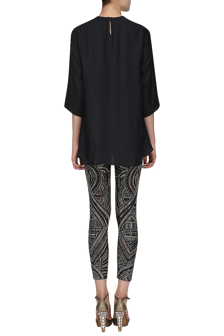 Black tasseled top with embroidered pants available only at Pernia's Pop Up Shop.