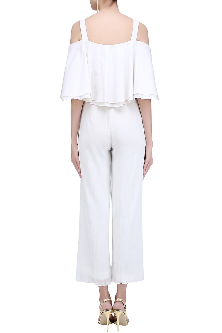 Ivory cold shoulder ruffled top and pants set available only at Pernia's Pop Up Shop.