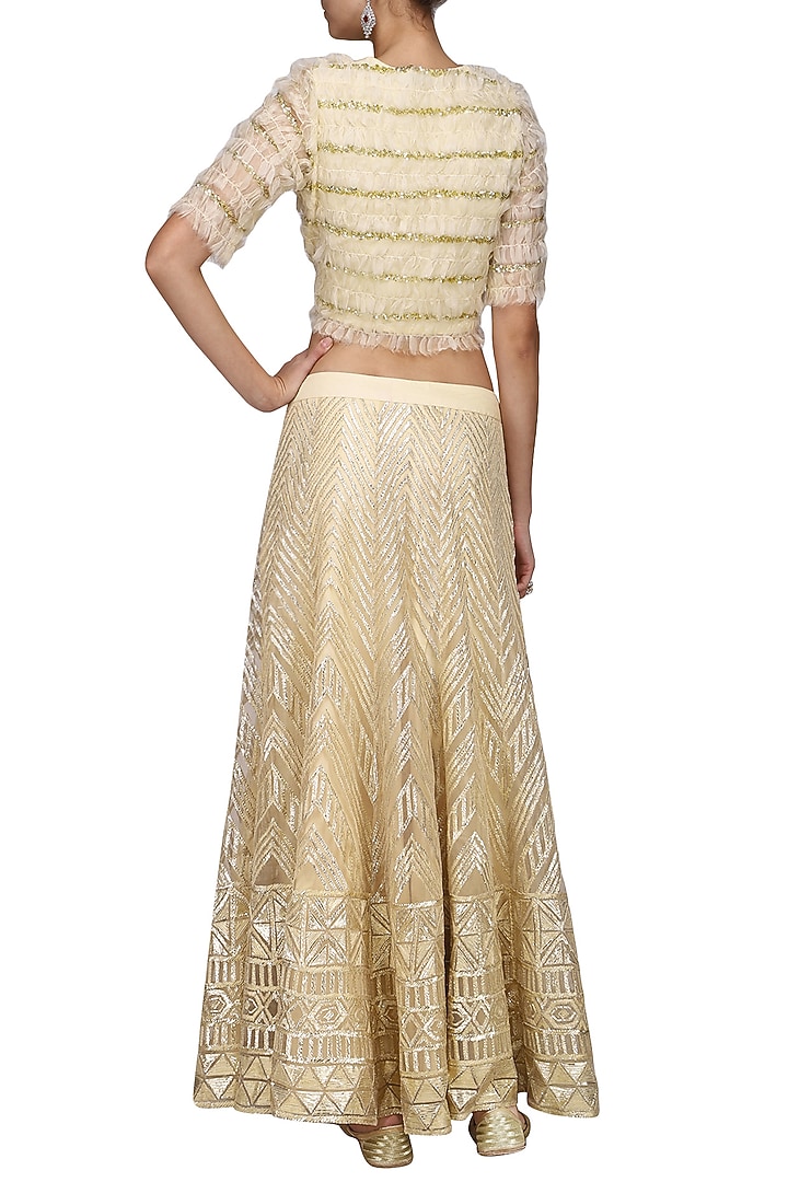 Nude embroidered lehenga with frayed jacket available only at Pernia's Pop Up Shop.