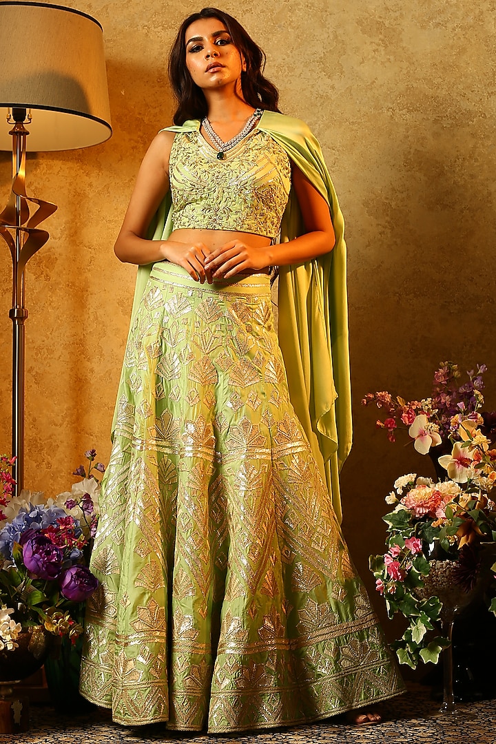 Mint green embroidered lehenga skirt with cape sleeves blouse available only at Pernia's Pop Up Shop.