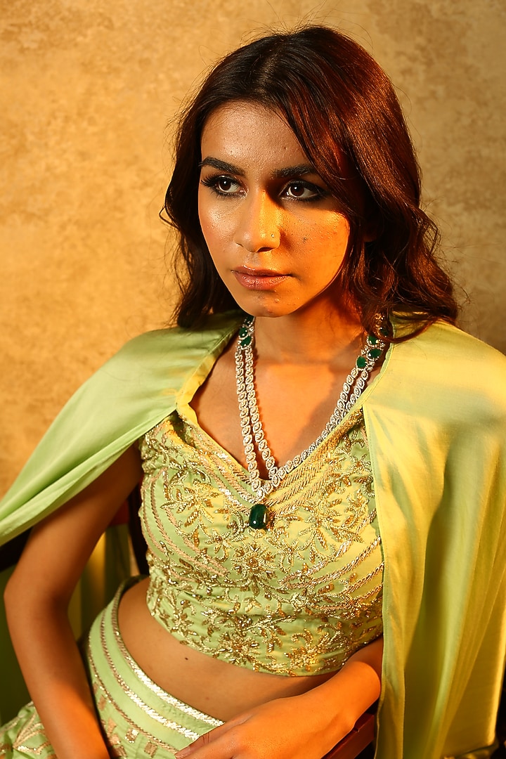 Mint green embroidered lehenga skirt with cape sleeves blouse available only at Pernia's Pop Up Shop.