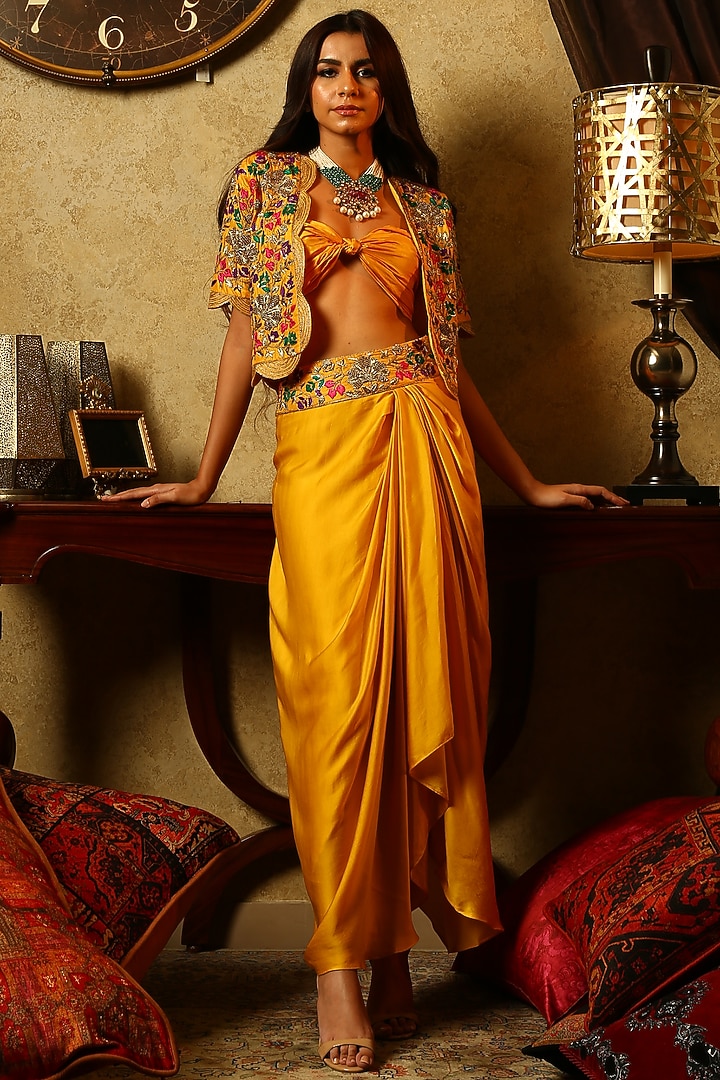Yellow embroidered jacket with dhoti skirt and bustier available only at Pernia's Pop Up Shop.