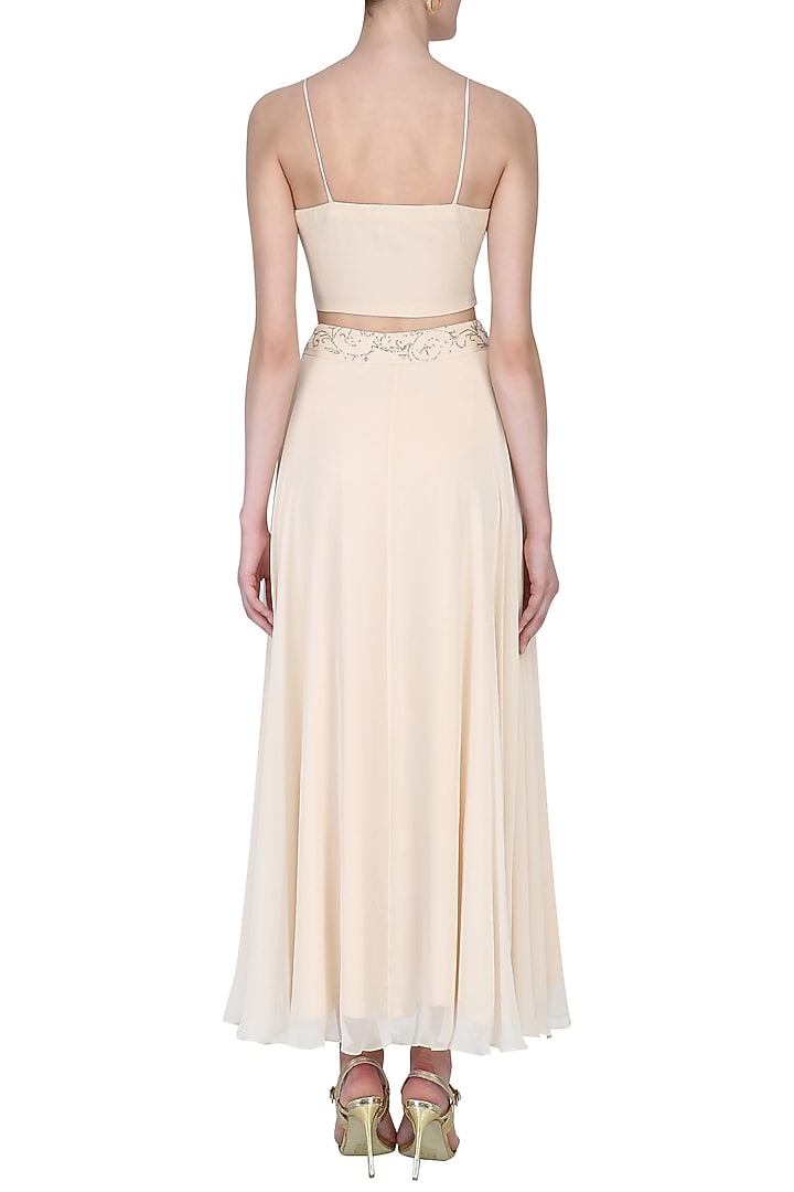 Light beige floral embroidered jacket, bralet and skirt set available only at Pernia's Pop Up Shop.