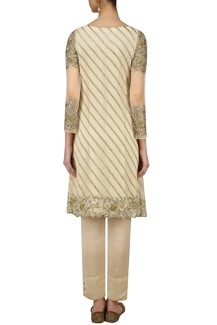 Beige gold and silver embroidered A line kurta and pencil pants set available only at Pernia's Pop Up Shop.