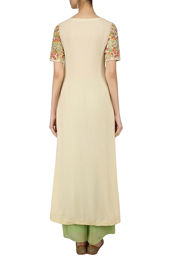 Cream floral embroidered front slit kurta and green palazzo set available only at Pernia's Pop Up Shop.