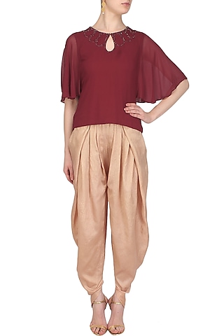 Burgundy Cutdana Embellished Flared Sleeved Top by Samatvam By Anjali Bhaskar