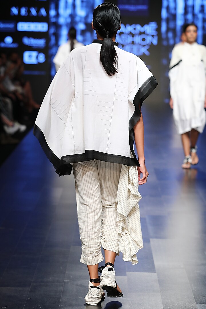 Off White Striped Fitted Trouser Pants With Attached Flare by Sayantan Sarkar at Pernia's Pop Up Shop