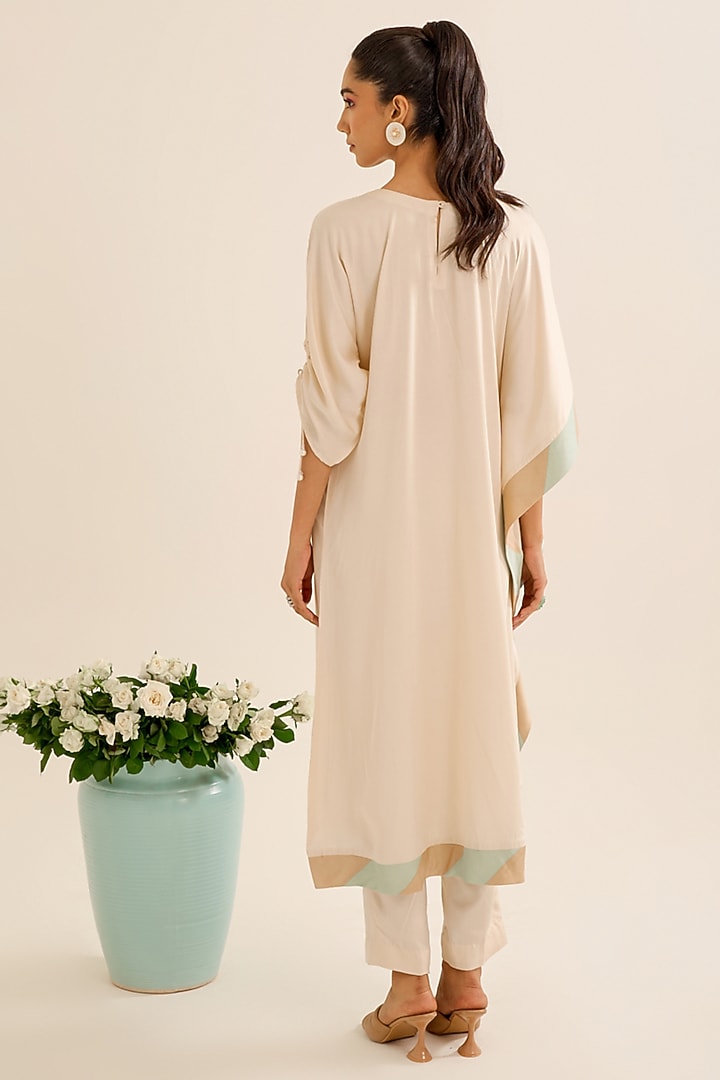 Ivory Satin Hand Embellished Asymmetric Kurta Set by Siyona By Ankurita at Pernia's Pop Up Shop