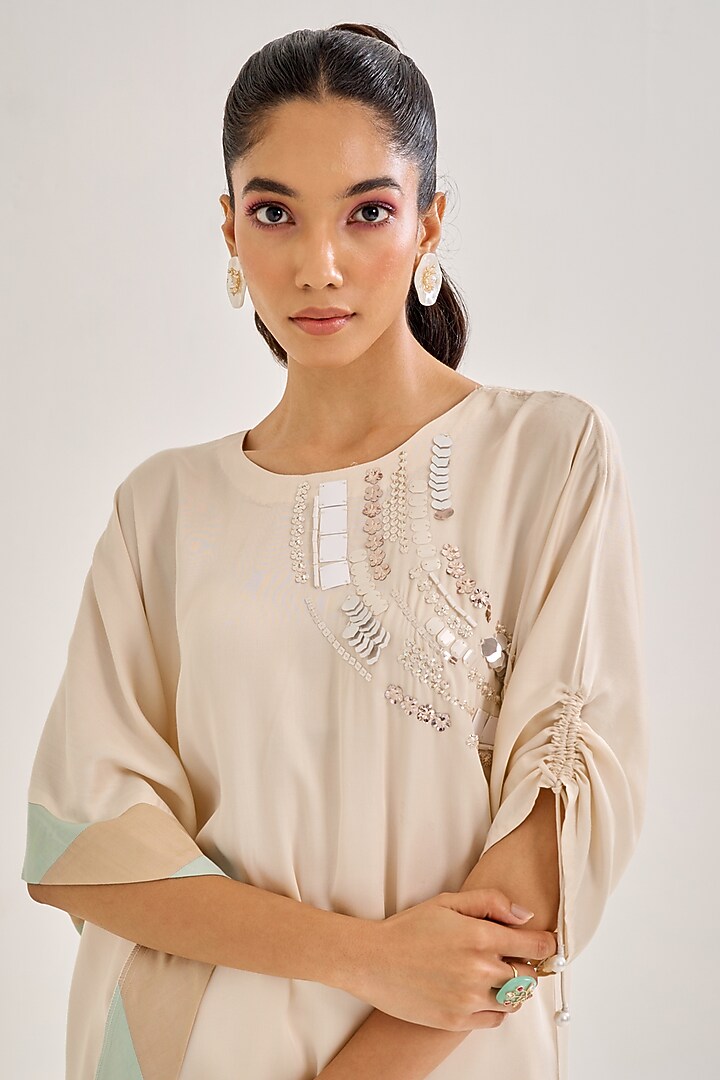 Ivory Satin Hand Embellished Asymmetric Kurta Set by Siyona By Ankurita at Pernia's Pop Up Shop