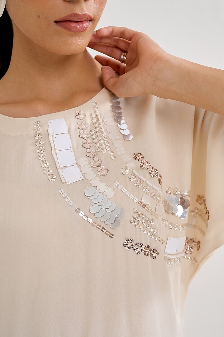 Ivory Satin Hand Embellished Asymmetric Kurta Set by Siyona By Ankurita at Pernia's Pop Up Shop