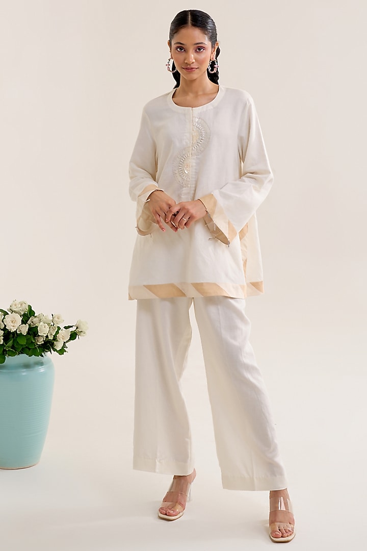 Ivory Linen Hand Embellished Tunic Set by Siyona By Ankurita at Pernia's Pop Up Shop