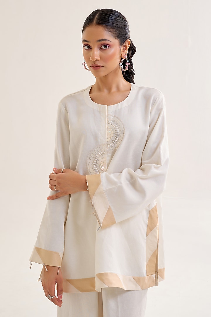 Ivory Linen Hand Embellished Tunic Set by Siyona By Ankurita at Pernia's Pop Up Shop
