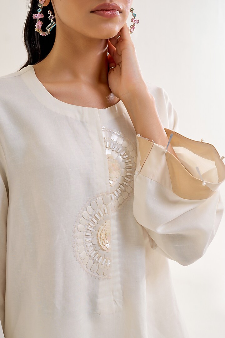 Ivory Linen Hand Embellished Tunic Set by Siyona By Ankurita at Pernia's Pop Up Shop