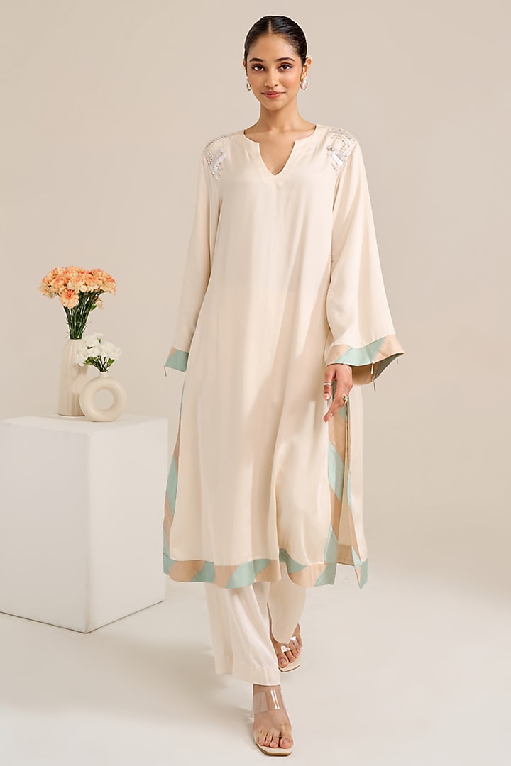 Ivory Satin Hand Embellished Kurta Set by Siyona By Ankurita at Pernia's Pop Up Shop