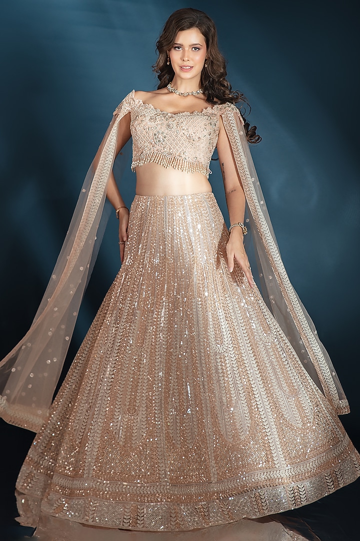 Nude Tulle Sequin Embroidered Wedding Lehenga Set by Saaj By Ankita at Pernia's Pop Up Shop