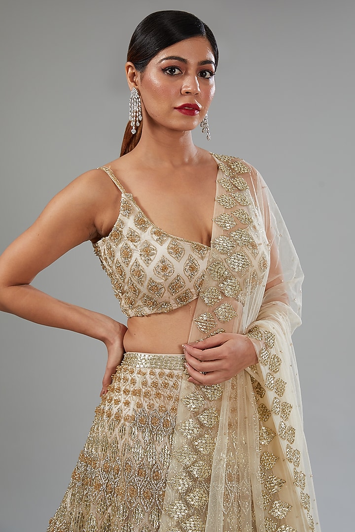 Ivory Net Sequins Embroidered Bridal Lehenga Set by Surabhi Chopra at Pernia's Pop Up Shop