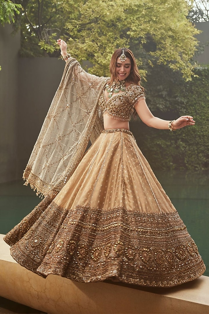 Golden Raw Silk Embellished Bridal Lehenga Set by Swish By dolcy and Simran at Pernia's Pop Up Shop