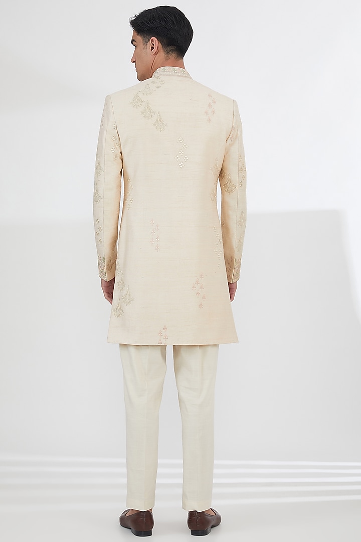 Light Peach Pink Raw Silk Thread Embroidered Wedding Sherwani Set by SBJ at Pernia's Pop Up Shop
