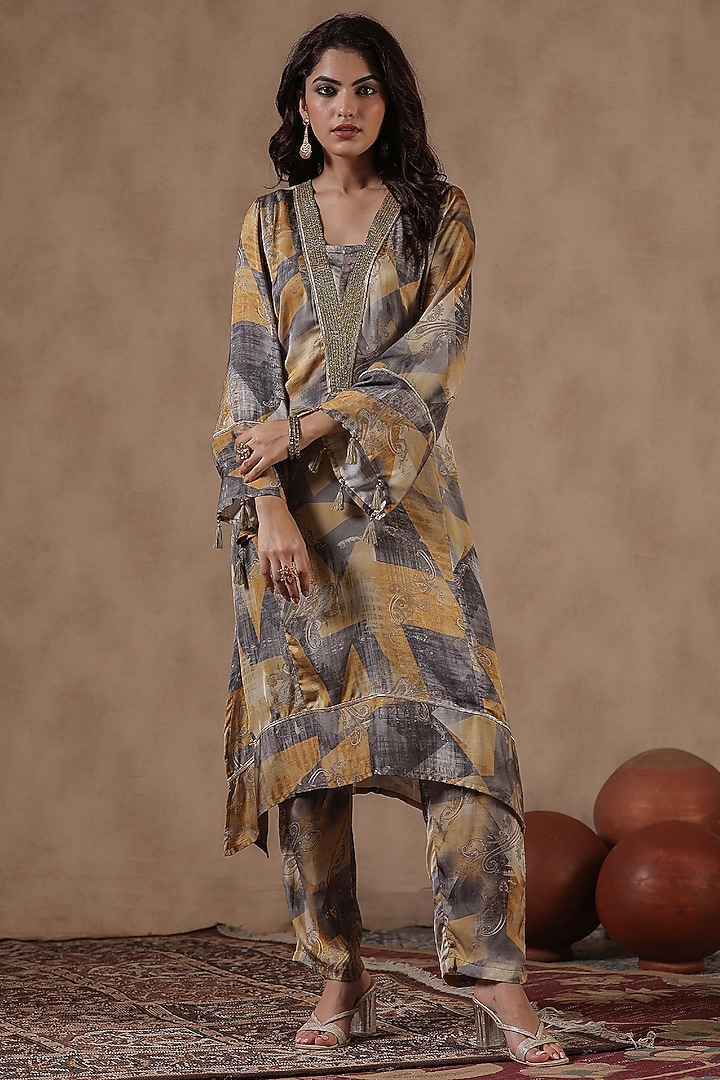 Mustard Satin Paisley Printed Asymmetric Kurta Set by Scakhi Luxe at Pernia's Pop Up Shop