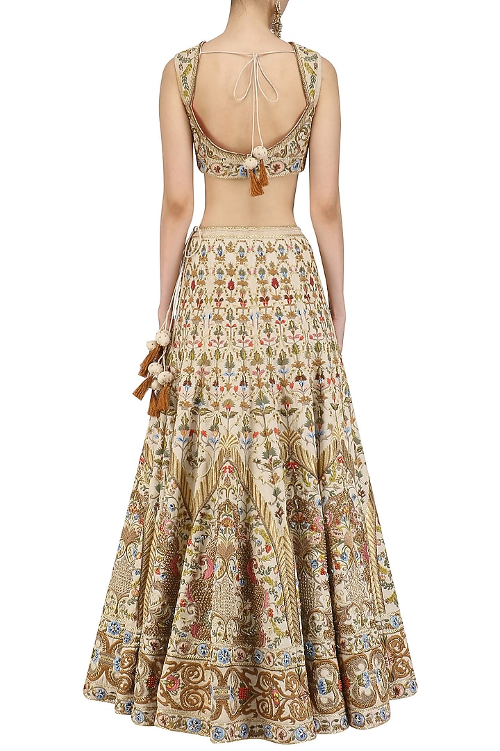 Ivory aand gold embroidered lehenga and blouse set available only at Pernia's Pop Up Shop.