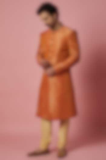 Orange Brocade Silk Embroidered Sherwani Set by SHIRRIN DESIGN CO. MEN