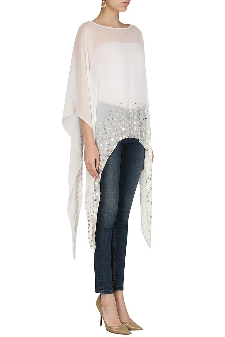 White coin embellished asymmetrical cape available only at Pernia's Pop Up Shop.