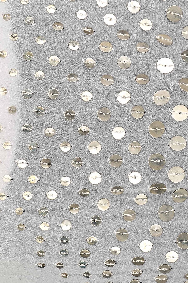 White coin embellished asymmetrical cape available only at Pernia's Pop Up Shop.