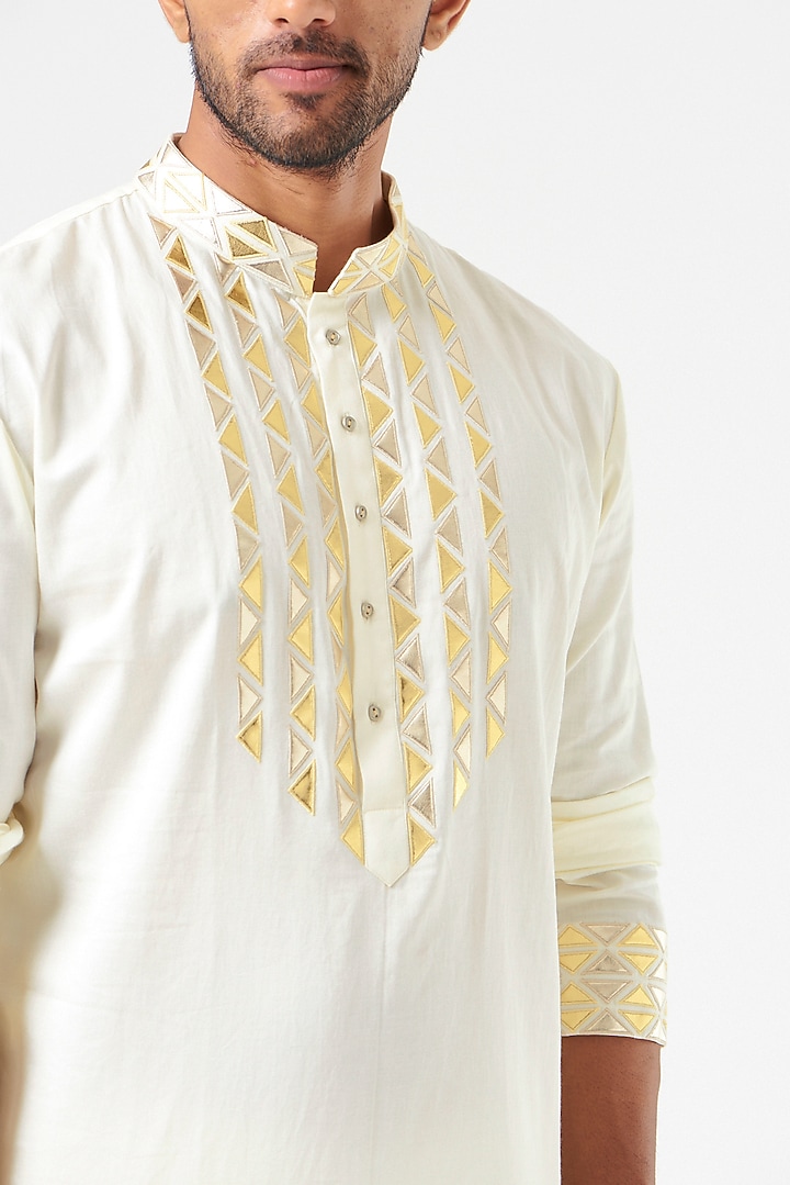 Ivory Patchwork Embroidered Kurta Set by SEVENDC MEN at Pernia's Pop Up Shop
