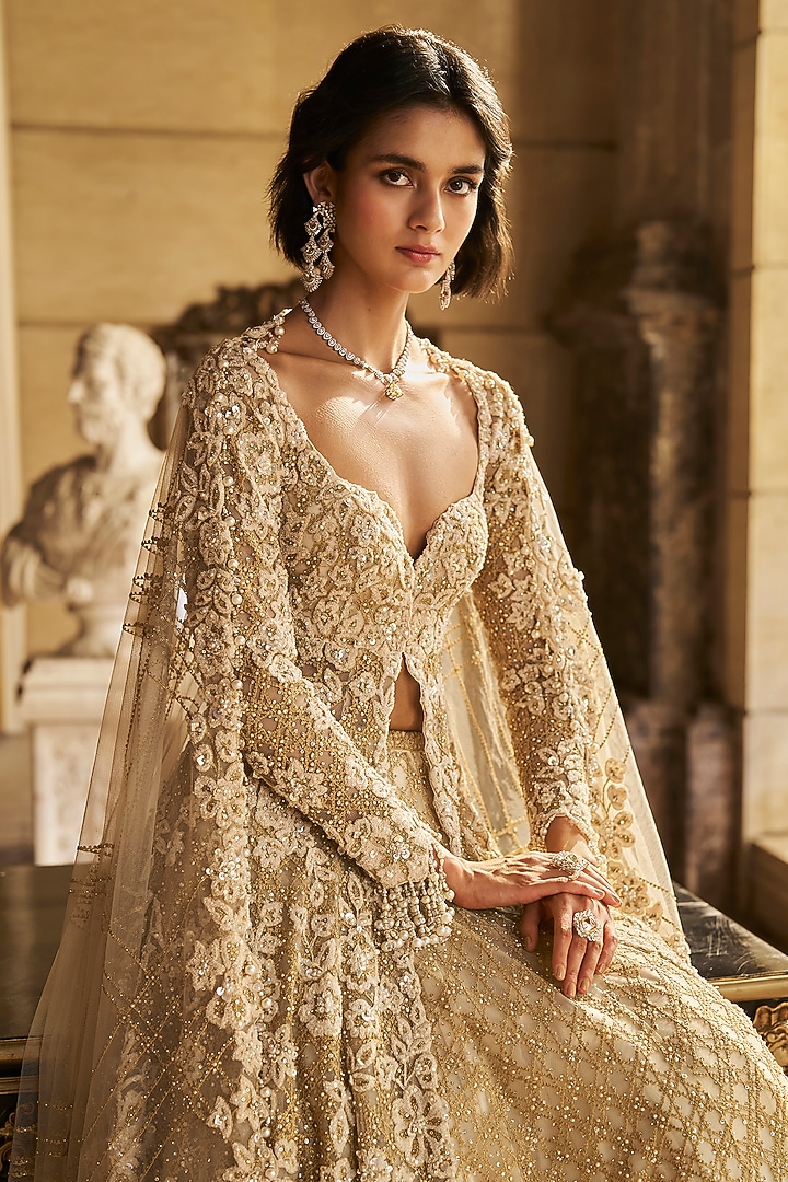 Cream Net Pearl Embroidered Jacket Bridal Lehenga Set by Seema Gujral at Pernia's Pop Up Shop
