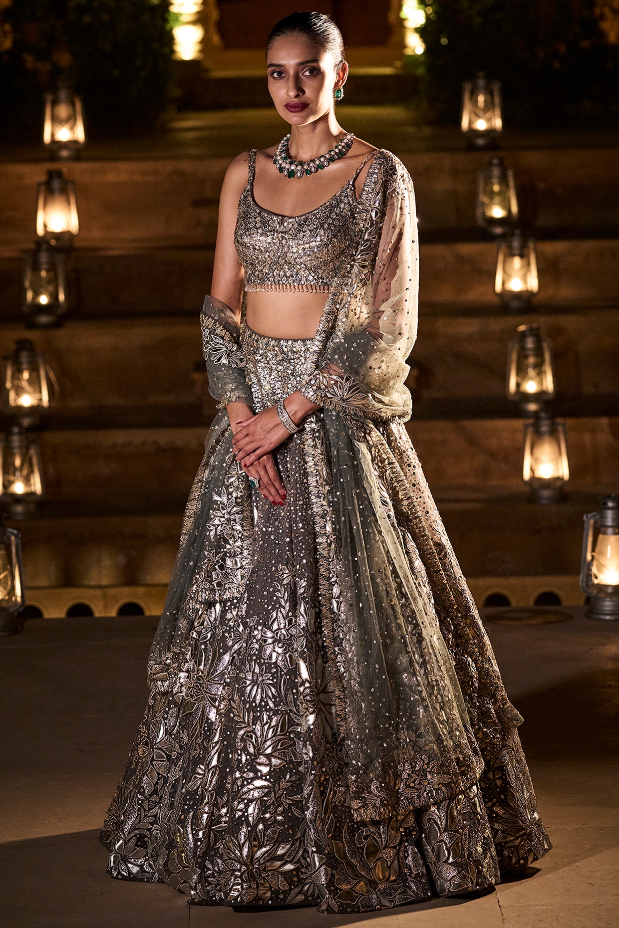 A pleated classic lehenga crafted from georgette base fabric, adorned with  delicate gold and silver leather