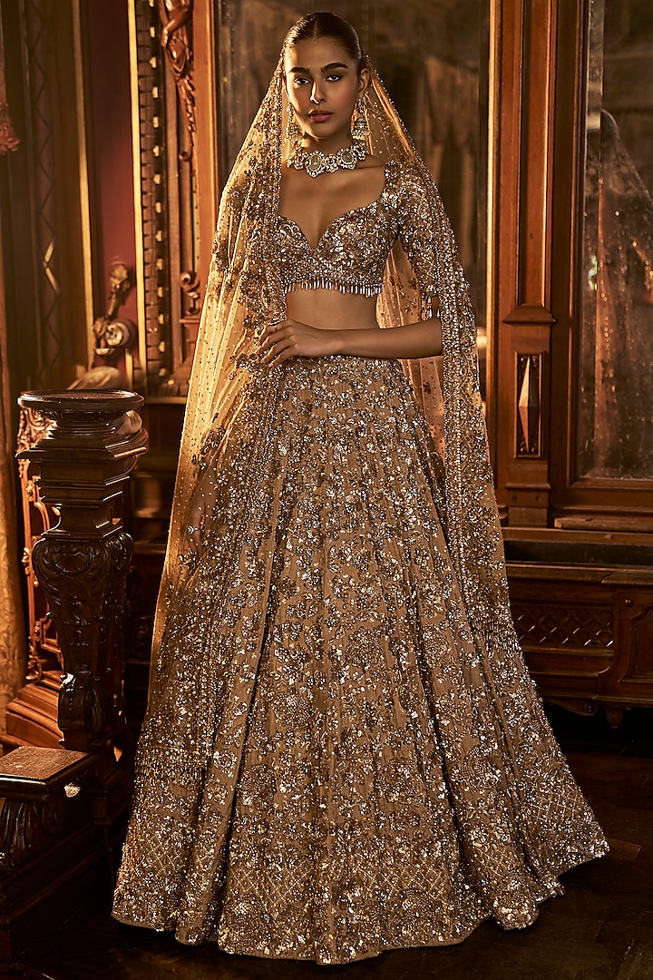 Antique Gold Tissue Silk Embroidered Lehenga Set by Seema Gujral