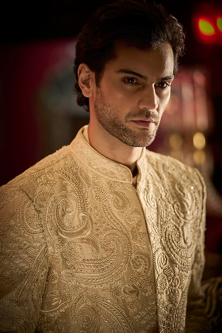 Cream Raw Silk Embroidered Bandhgala Set With Juttis by Seema Gujral Men at Pernia's Pop Up Shop