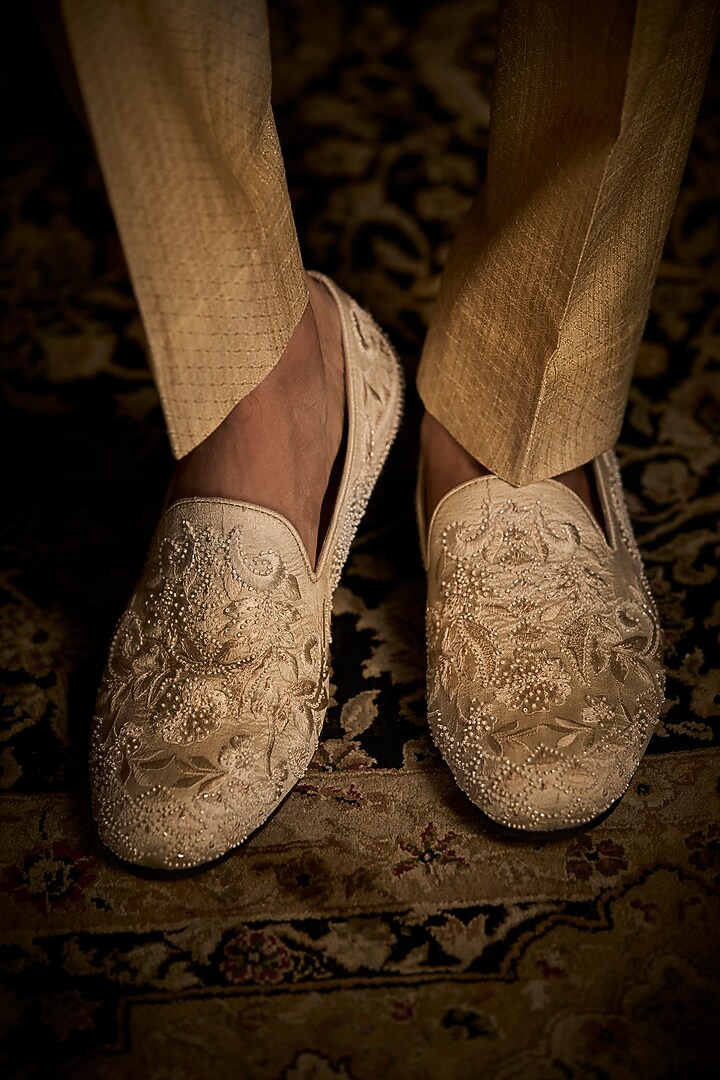 Cream Raw Silk Embroidered Bandhgala Set With Juttis by Seema Gujral Men at Pernia's Pop Up Shop