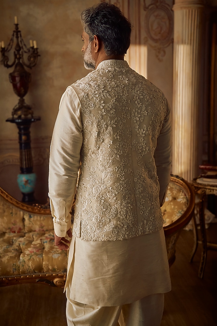 Champagne Raw Silk Floral Embroidered Bundi Jacket Set by Seema Gujral Men at Pernia's Pop Up Shop